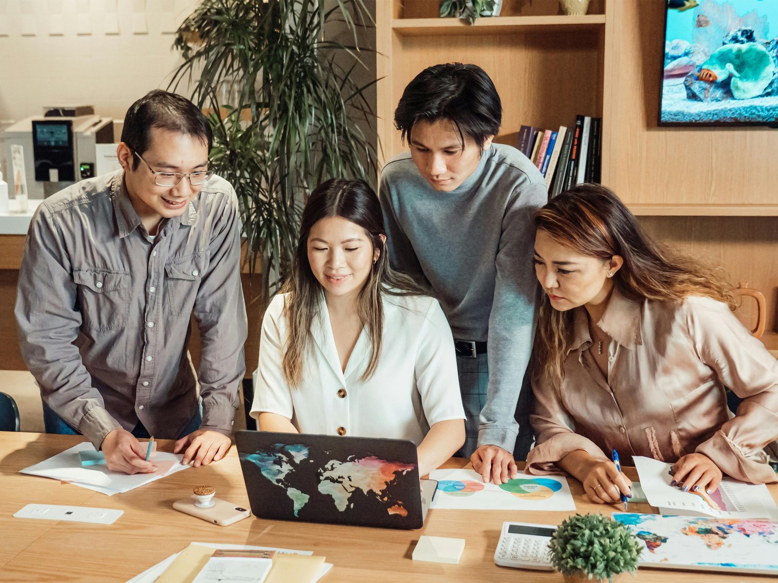 Team discussing over a laptop