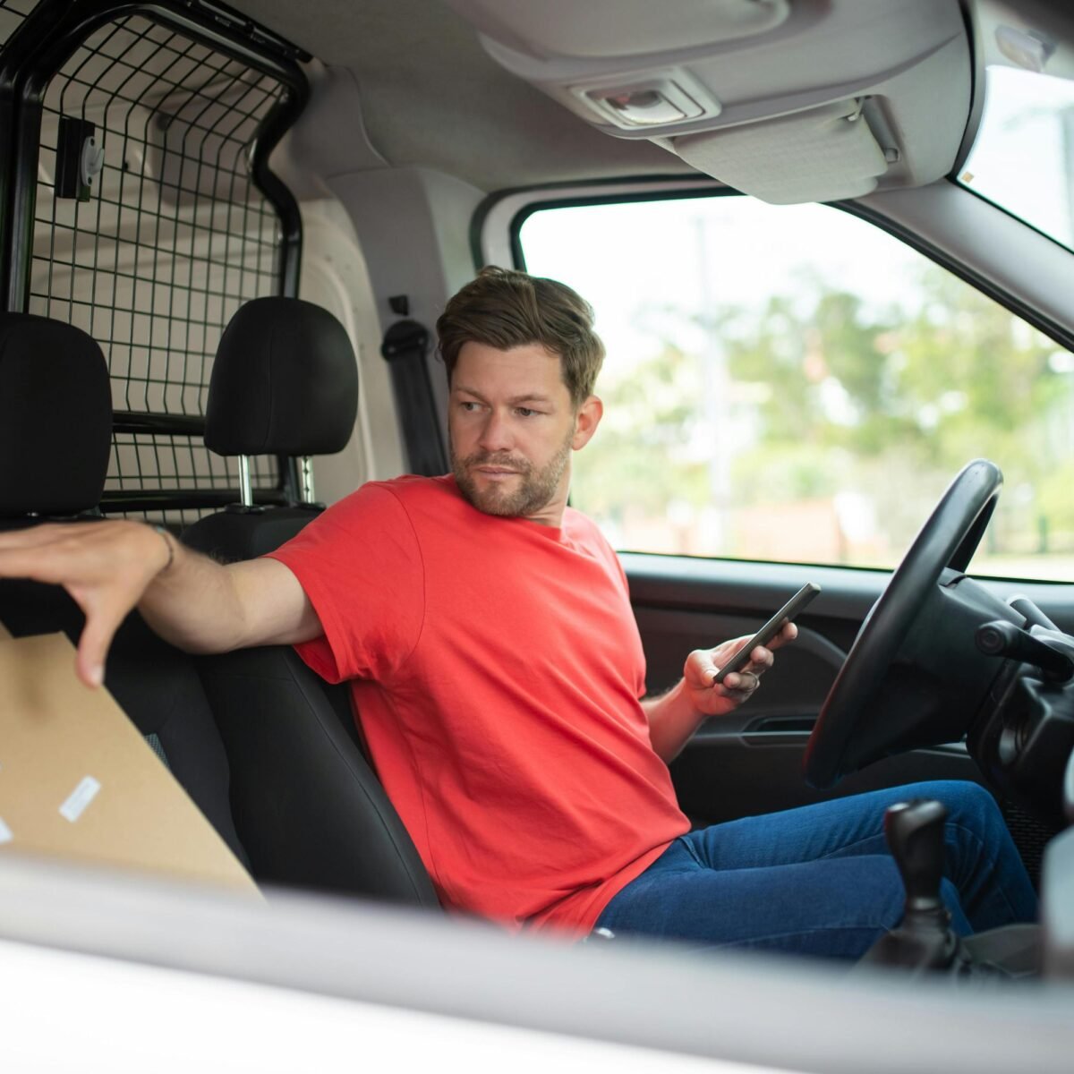 Young men driving a car